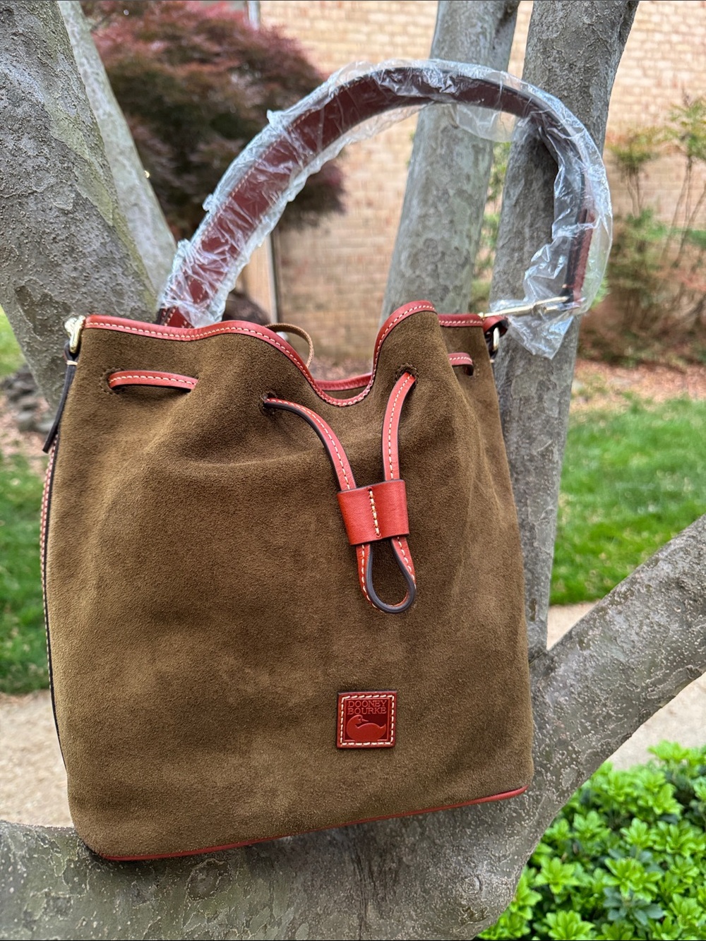 Dooney & Bourke Brown Suede Bucket Bag with brown leather trim & red lining